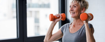 exercise hurdles - woman lifting weights