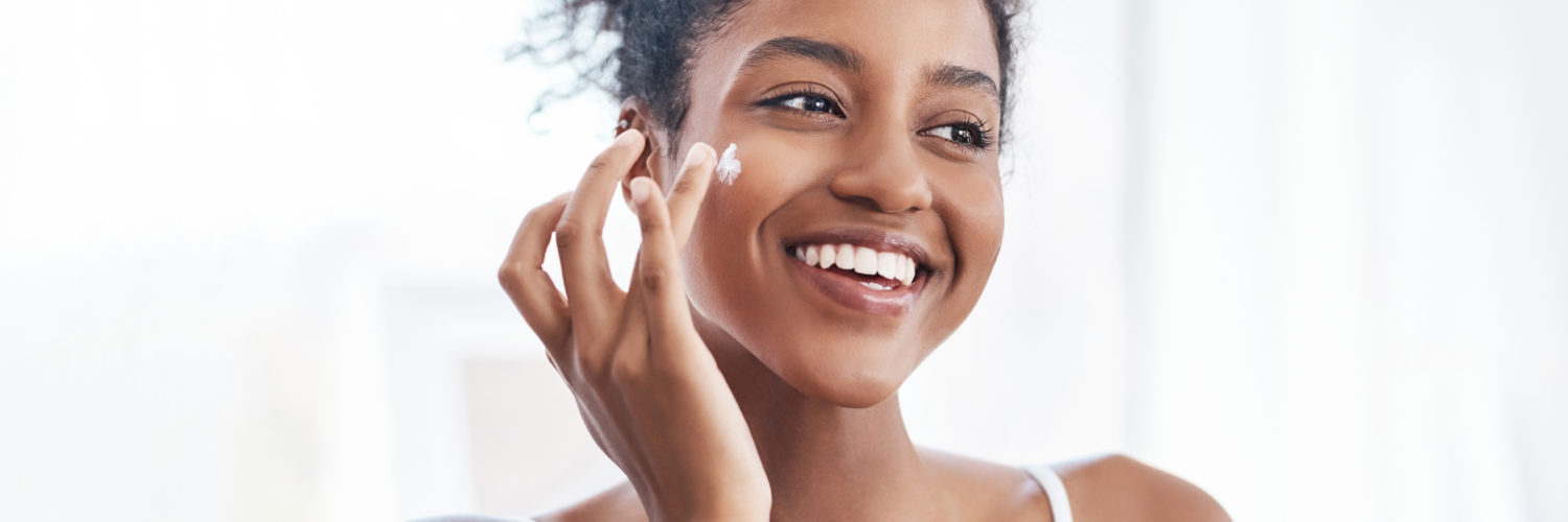 spring checklist - woman putting on face cream