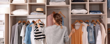 the details- woman picking out outfit