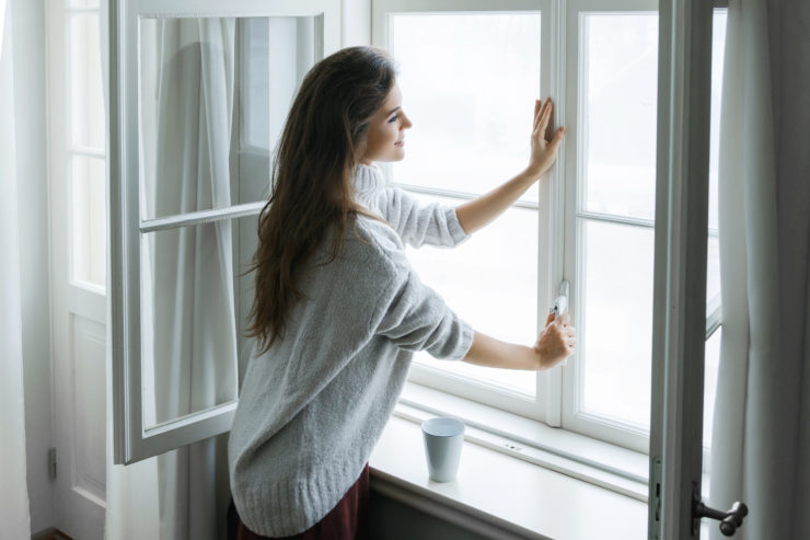 woman by window