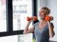 exercise hurdles - woman lifting weights