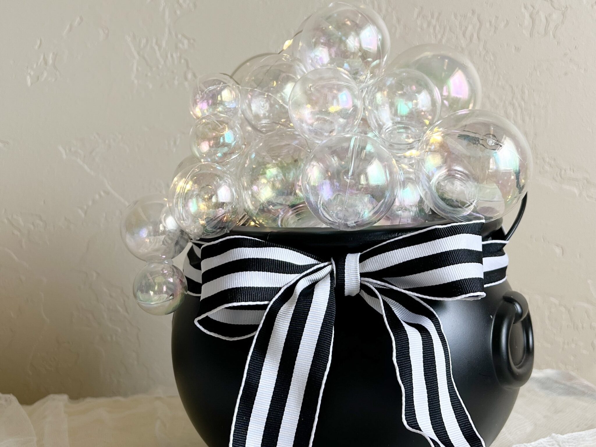 Build a bubbling cauldron with Christmas ornaments! This easy DIY takes