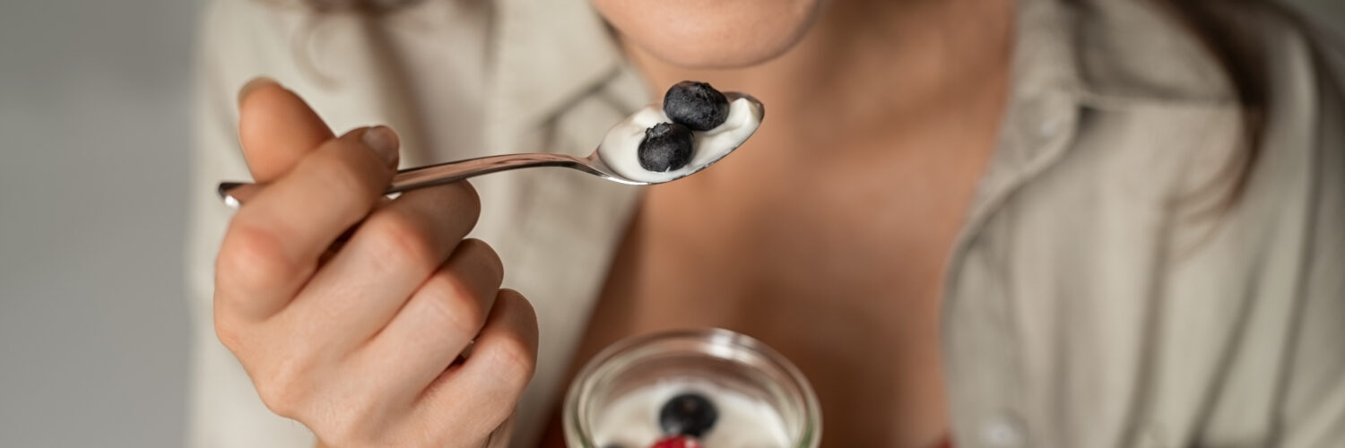 diet and mental health - woman eating berries