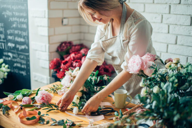 woman arranging flowers