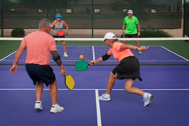 get better at pickleball - group playing pickleball