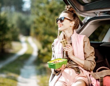 savvy snacking - woman eating in car