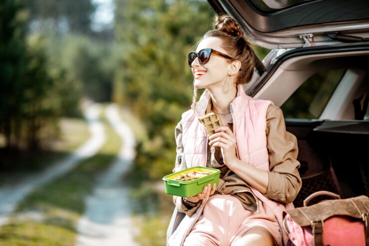 savvy snacking - woman eating in car