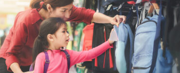 mom and daughter backpack shopping