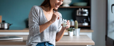 protein-packed yogurt - woman eating yogurt