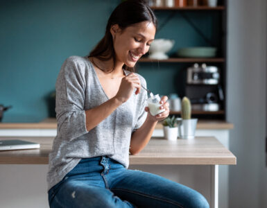 protein-packed yogurt - woman eating yogurt