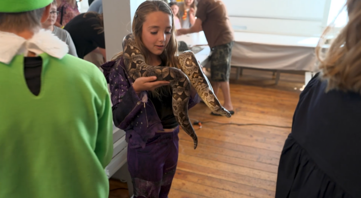 girl holding snake