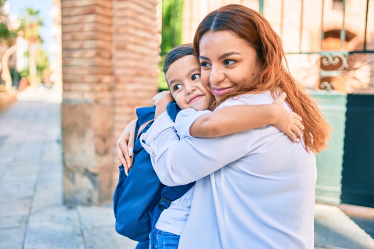 experiencing discomfort - mom and son hug