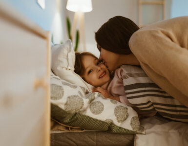 sleep podcasts - mom and daughter at bedtime