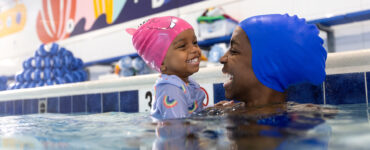 mom and girl swimming