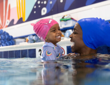mom and girl swimming