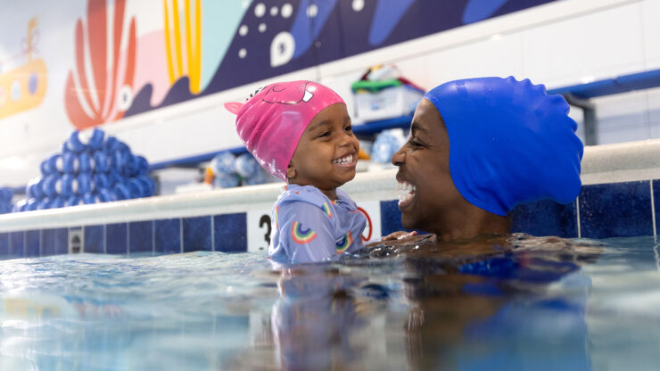 mom and girl swimming