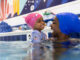 mom and girl swimming