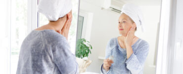 aging well - woman looking in mirror