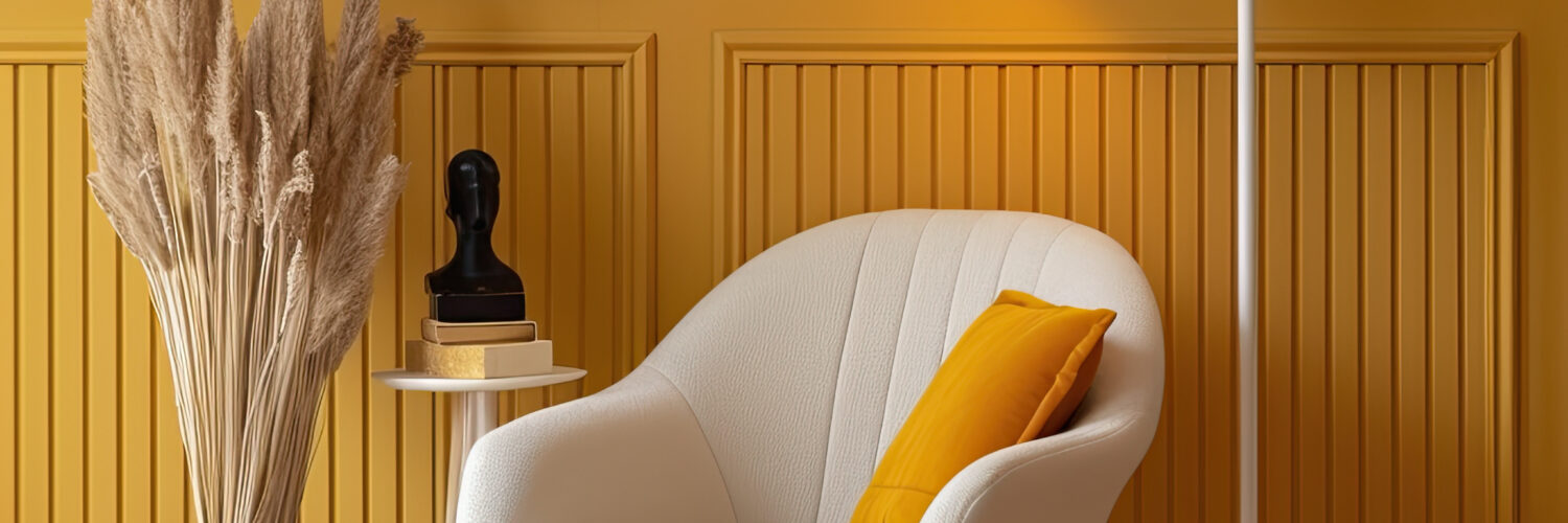 chair and lamp sitting area with yellow wall